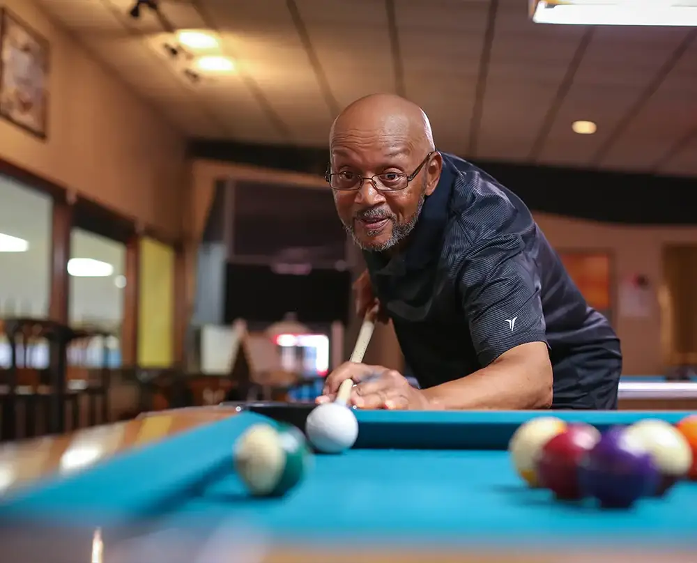 man playing billiards at St. Clair Bowl in Fairview Heights IL