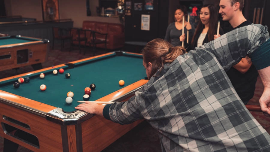Friends enjoying a game of pool at St. Clair Bowl in Fairview Heights IL