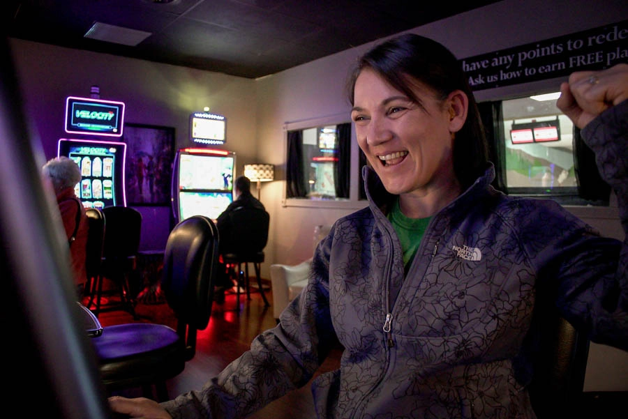 Woman celebrating while playing at Trixie’s Gaming Parlor
